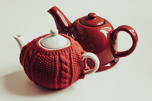 Red teapot and red sweater cozy teapot