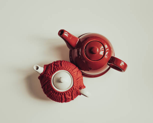 istock Red teapot and red sweater cozy teapot seen from above 1440922510