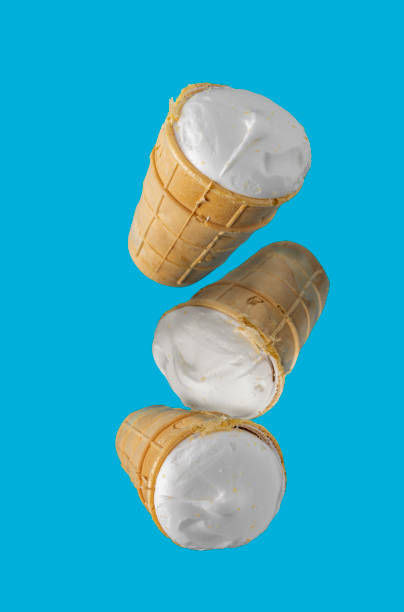 istock ice creams in waffle cups fly on a blue background 1440922818