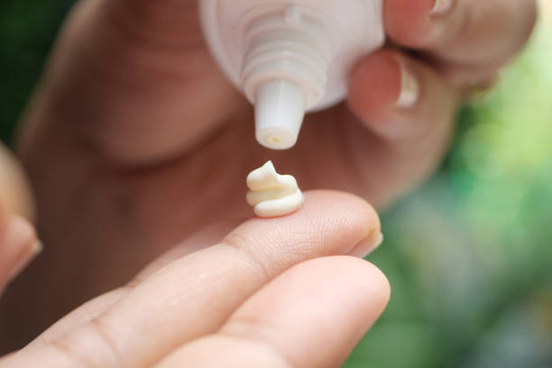 istock Close up of using sunscreen cream 1440924315