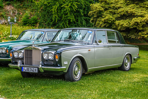 Baden-Baden, Germany - 14 July 2019: black silver gray Rolls-Royce Silver Shadow sedan limousine 1965 1980 is parked in Kurpark in Baden-Baden at the exhibition of old cars \