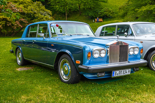 Baden-Baden, Germany - 14 July 2019: blue Rolls-Royce Silver Shadow sedan limousine 1965 1980 is parked in Kurpark in Baden-Baden at the exhibition of old cars \