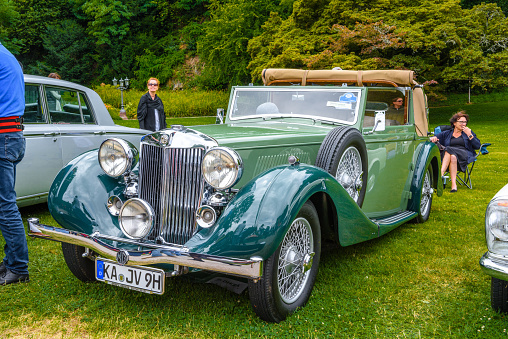 Baden-Baden, Germany - 14 July 2019: green MG Morris WA 1938 1939 cabrio roadster is parked in Kurpark in Baden-Baden at the exhibition of old cars \