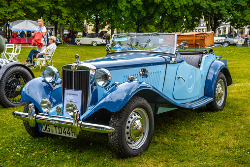 Baden-Baden, Germany - 14 July 2019: blue Morris MG T-Type TA TB TC Midget cabrio roadster 1936 1955 is parked in Kurpark in Baden-Baden at the exhibition of old cars 