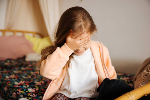 istock Headache and child feeling sick in bed 1440926516