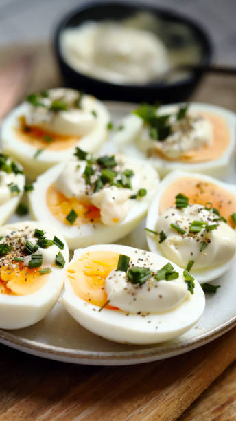 istock Boiled egg halves with mayonnaise and green onions. 1440926681