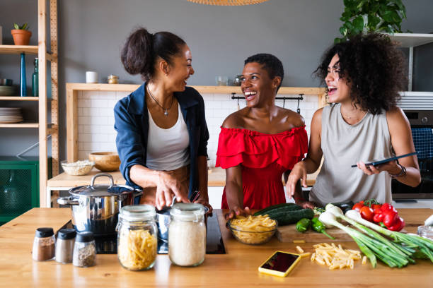 istock Three mixed race hispanic and black women bonding at home 1440927122