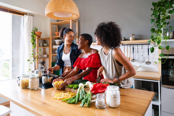 istock Three mixed race hispanic and black women bonding at home 1440927474