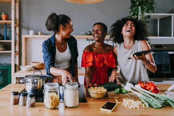 istock Three mixed race hispanic and black women bonding at home 1440927527