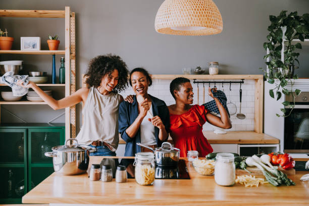 istock Three mixed race hispanic and black women bonding at home 1440927612