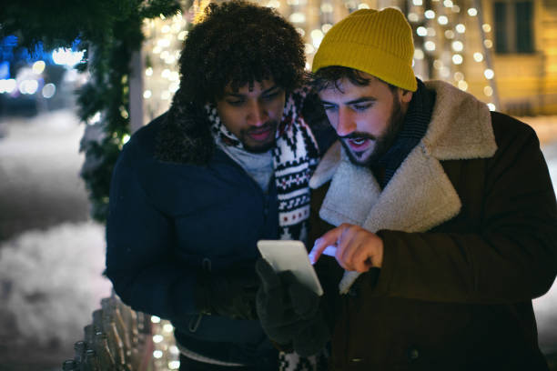 istock Friends surfing the net on the night out. 1440928177