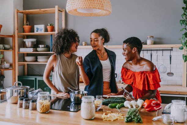 istock Three mixed race hispanic and black women bonding at home 1440928196