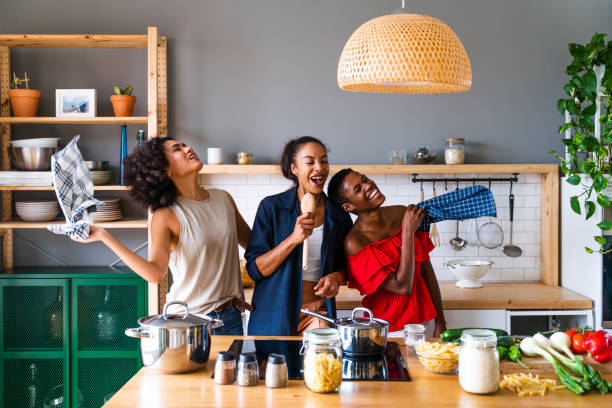 istock Three mixed race hispanic and black women bonding at home 1440928265