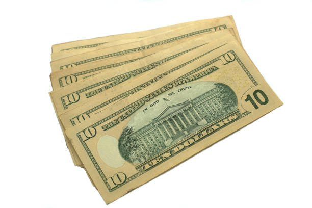 10 Dollar bills isolated on white background stock photo