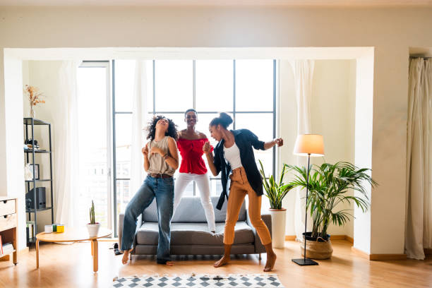 istock Three mixed race hispanic and black women bonding at home 1440928376