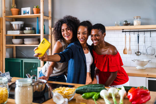 istock Three mixed race hispanic and black women bonding at home 1440928901