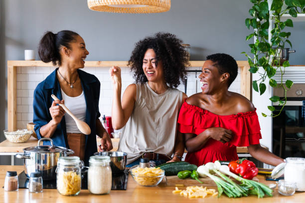 istock Three mixed race hispanic and black women bonding at home 1440928919