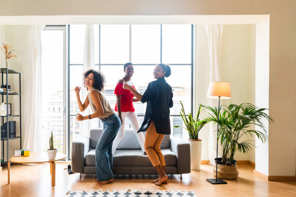 istock Three mixed race hispanic and black women bonding at home 1440928960