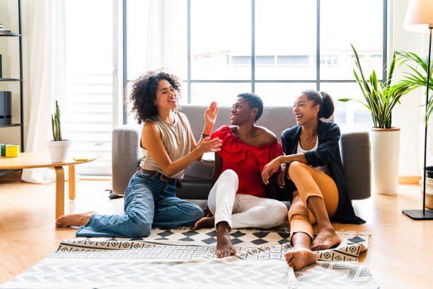istock Three mixed race hispanic and black women bonding at home 1440929003