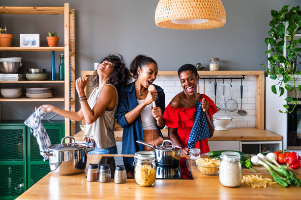 istock Three mixed race hispanic and black women bonding at home 1440929710
