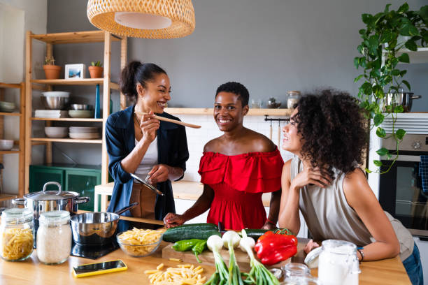 istock Three mixed race hispanic and black women bonding at home 1440929764