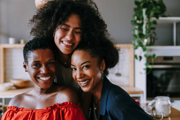istock Three mixed race hispanic and black women bonding at home 1440930115