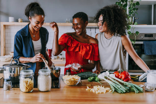 istock Three mixed race hispanic and black women bonding at home 1440930159