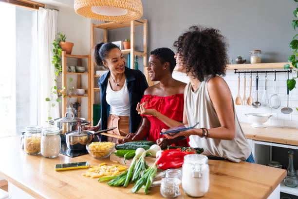 istock Three mixed race hispanic and black women bonding at home 1440930274