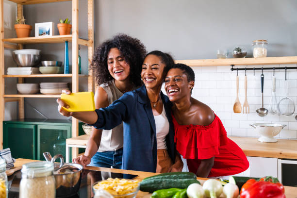 istock Three mixed race hispanic and black women bonding at home 1440930498