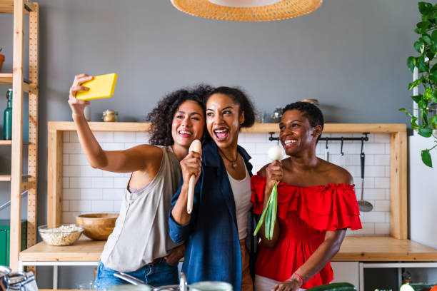 istock Three mixed race hispanic and black women bonding at home 1440930688