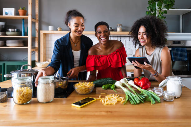 istock Three mixed race hispanic and black women bonding at home 1440931279