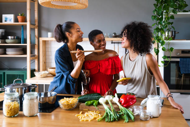 istock Three mixed race hispanic and black women bonding at home 1440931311