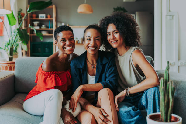 istock Three mixed race hispanic and black women bonding at home 1440931508