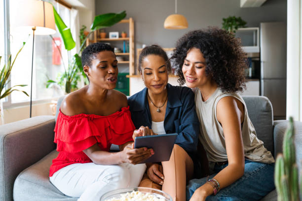 istock Three mixed race hispanic and black women bonding at home 1440931633