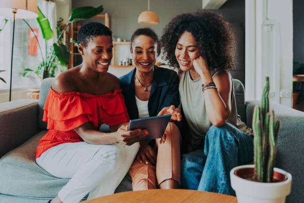 istock Three mixed race hispanic and black women bonding at home 1440931744