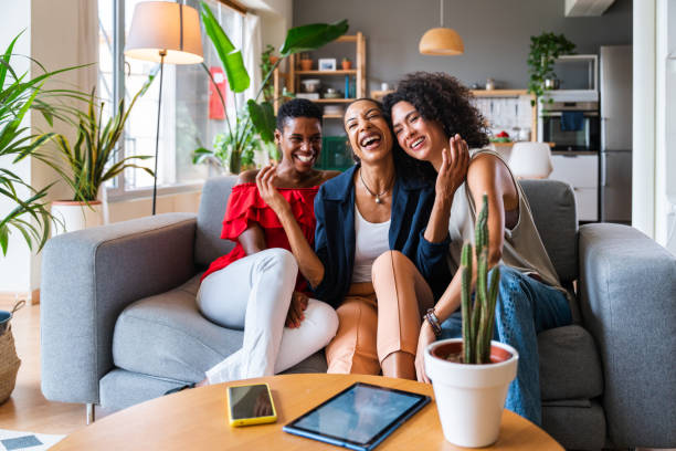 istock Three mixed race hispanic and black women bonding at home 1440931847