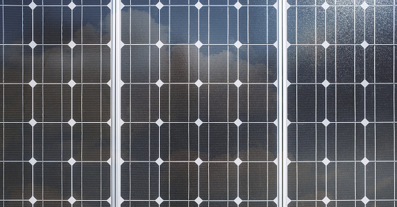 Photovoltaic PV modules of a Solar energy power plant. Solar panels use sunlight as a source of energy to generate direct current electricity.