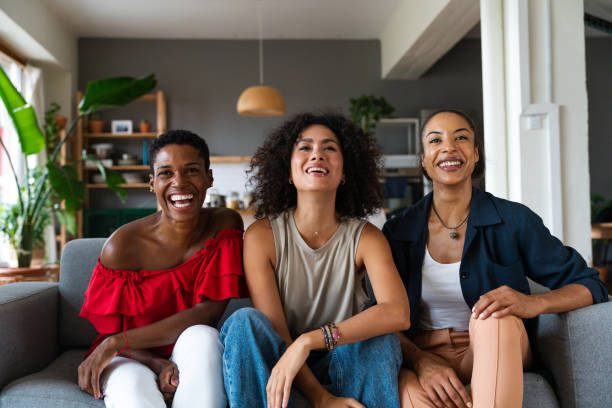 istock Three mixed race hispanic and black women bonding at home 1440932928