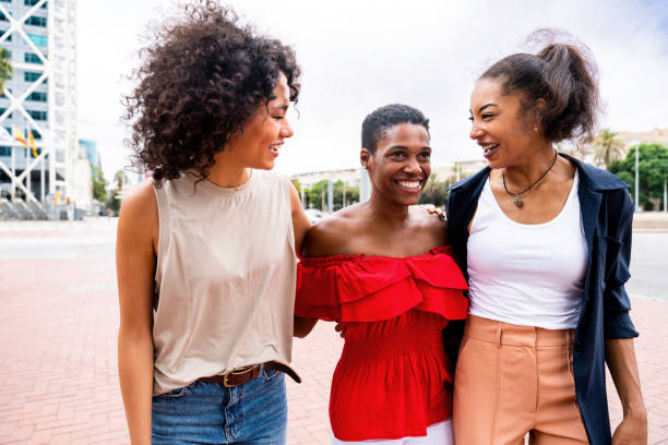 istock Three mixed race hispanic and black women bonding outdoors 1440933101