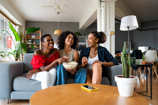 istock Three mixed race hispanic and black women bonding at home 1440933671