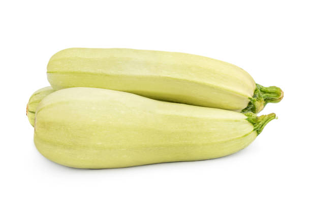 istock Pile of ripe zucchini on a white. 1440933748