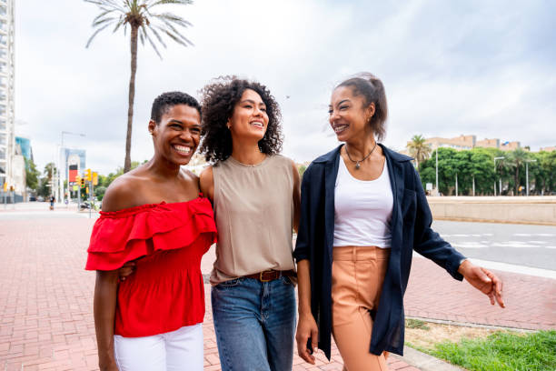 istock Three mixed race hispanic and black women bonding outdoors 1440934003