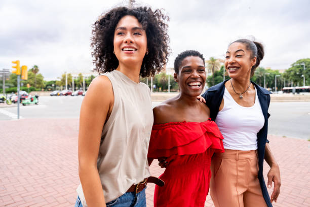 istock Three mixed race hispanic and black women bonding outdoors 1440934041