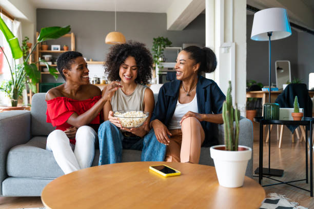 istock Three mixed race hispanic and black women bonding at home 1440934095