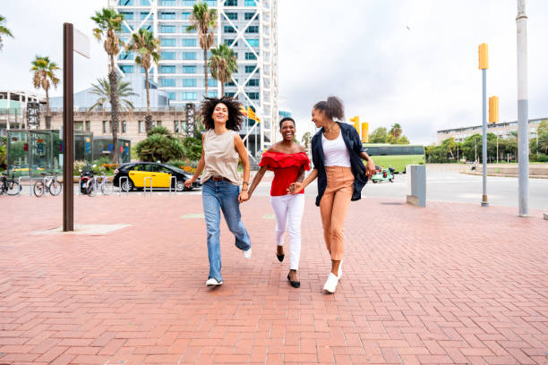 istock Three mixed race hispanic and black women bonding outdoors 1440934115
