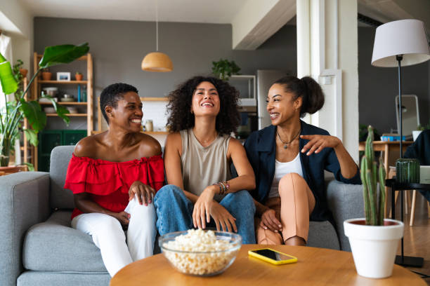 istock Three mixed race hispanic and black women bonding at home 1440934141