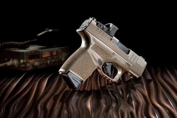 istock Pistol and two way radio 1440934214