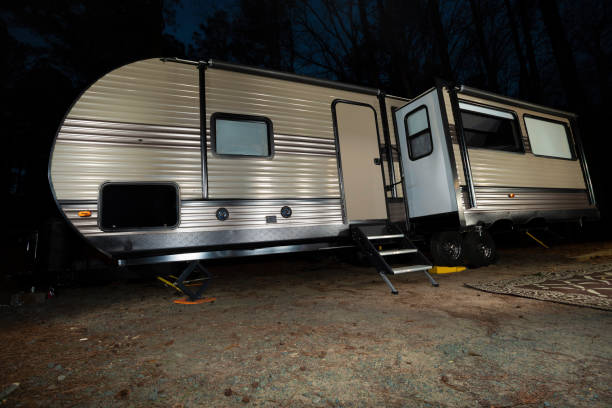 istock Long RV at night in a forest 1440934220