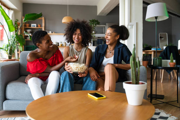 istock Three mixed race hispanic and black women bonding at home 1440934810