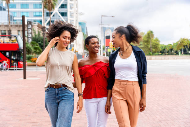 istock Three mixed race hispanic and black women bonding outdoors 1440934825